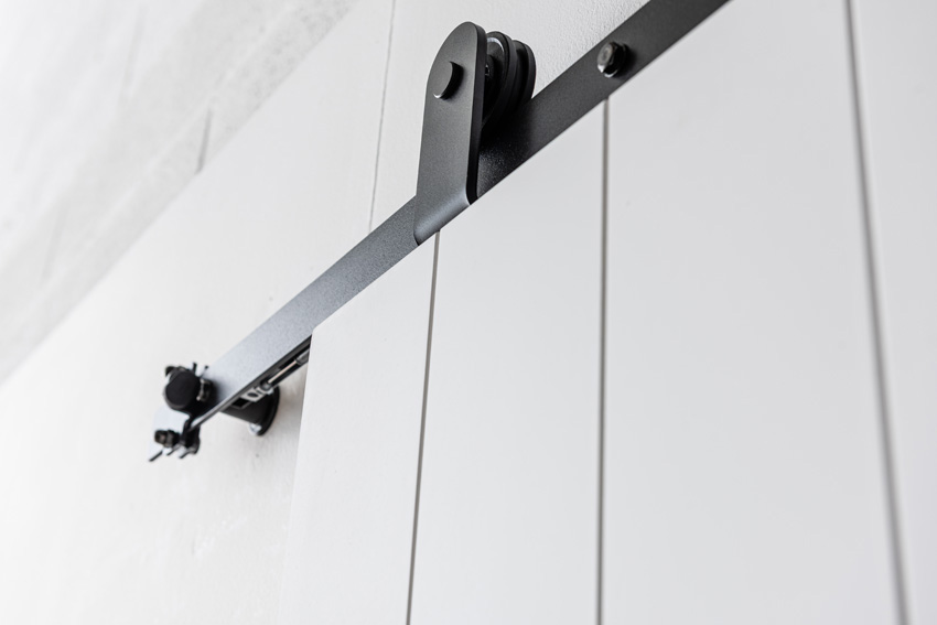 Porte coulissante simple à peindre complète Titus 93x211,5cm + rail noir antique
