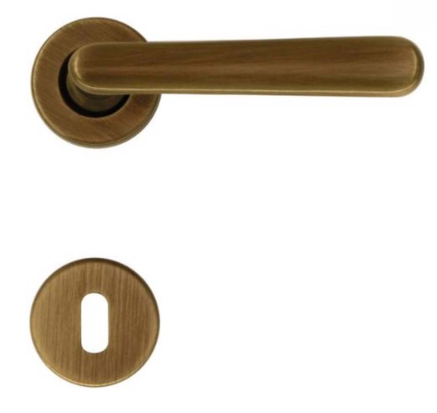 Deurkruk pro Vera brons rond complete set met rozetten en sleutelplaat