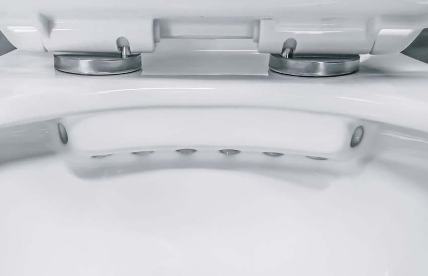 Toilette suspendue sans rebord blanc brillant avec siège WC